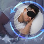 Man,With,Foam,Ear,Plugs,And,Mask,Sleeping,In,Bed.